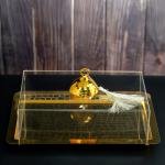 luxurious serving tray with a golden dome-shaped cover with a ring handle