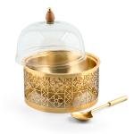 وعاء طعام بشكل قبة مطلي بالذهب مع ملعقة تقديم