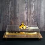 luxurious serving tray with a golden dome-shaped cover with a ring handle