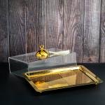 luxurious serving tray with a golden dome-shaped cover with a ring handle