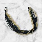 Multi-Strand Beaded Statement Necklace with Black and Gold Accents